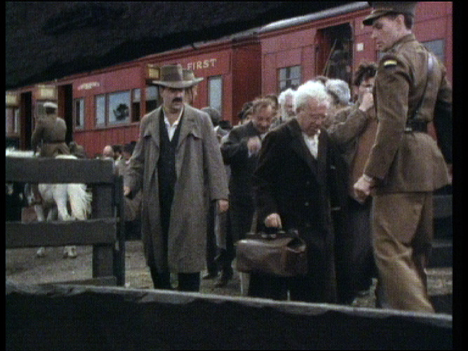 Photo copyright: Weis Films. Men in front of a train.