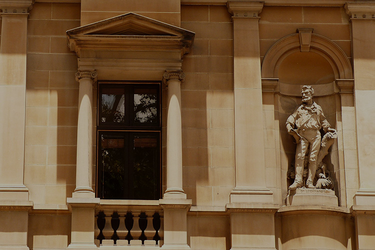 Photo: facade of building with statue