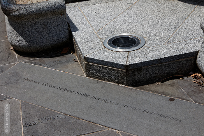 Photo © D Nutting: inscription on a fountain
